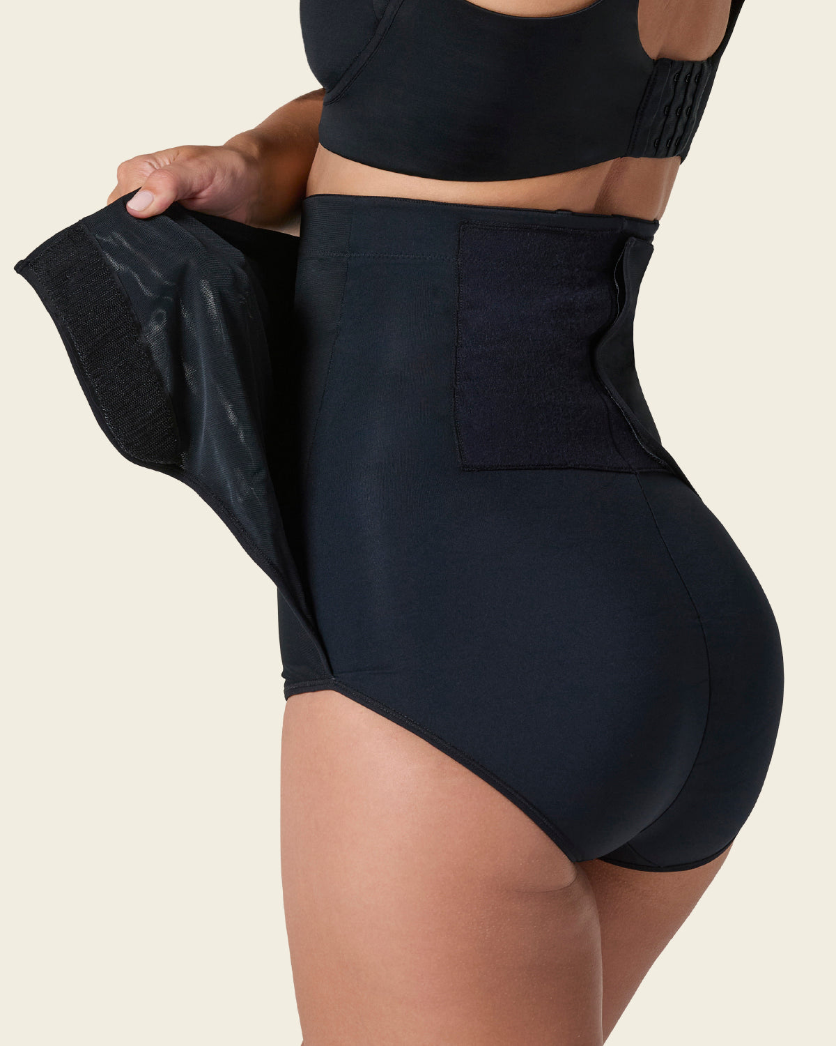 High-waisted firm compression postpartum panty with adjustable belly wrap#color_700-black